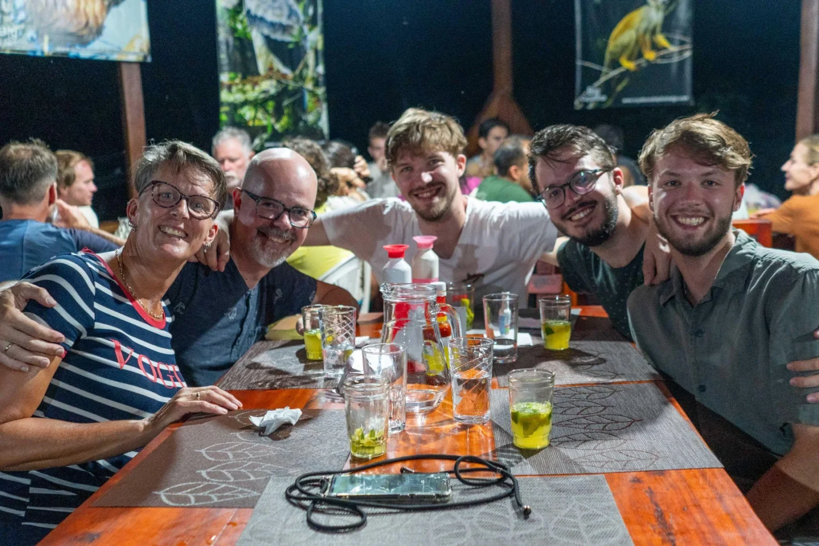 Travellers sharing dinner at the Napo Amazon EcoLodge dining hall